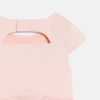 Girl's pink dress with cut-out flowers
