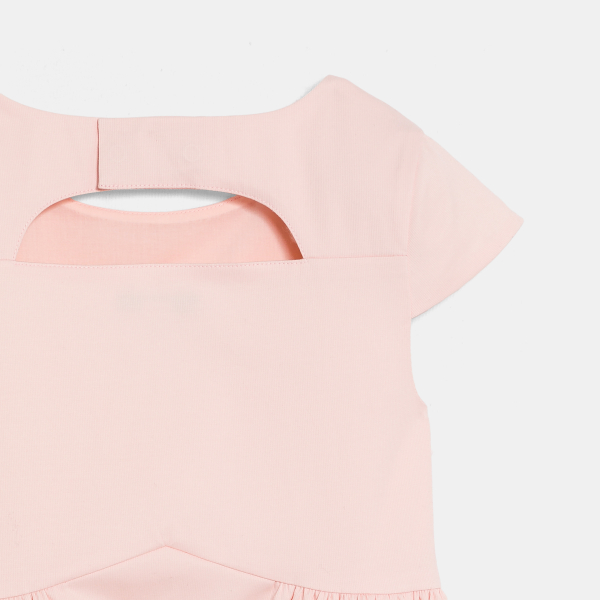 Girl's pink dress with cut-out flowers