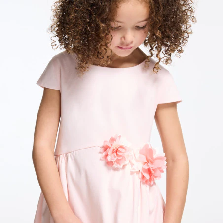 Baby girl's pink dress with textured rose