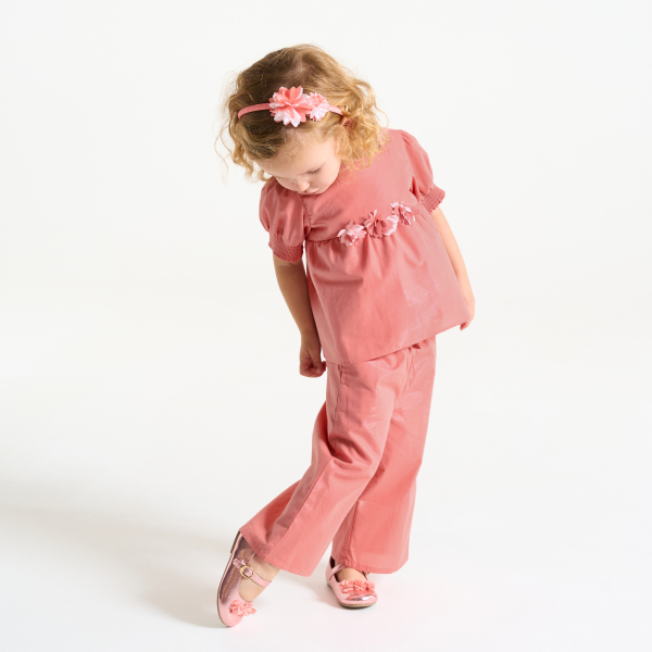 Baby girl's shiny pink wide-leg trousers with bow