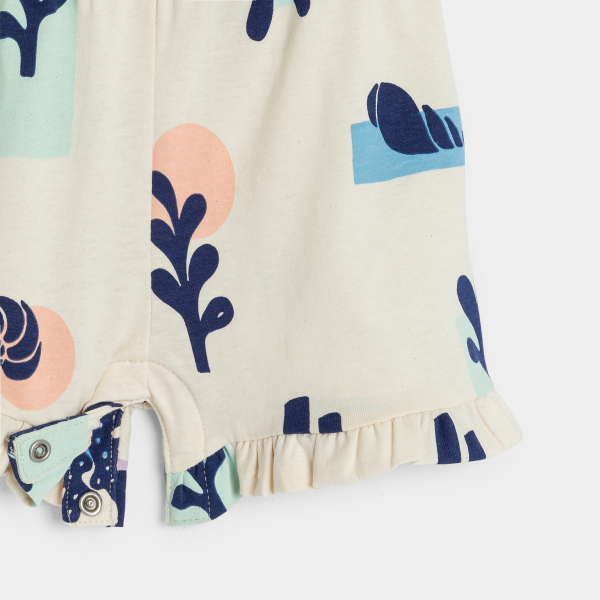 Baby girl's white playsuit with straps