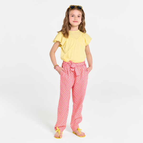 Girls orange printed wide leg trousers.