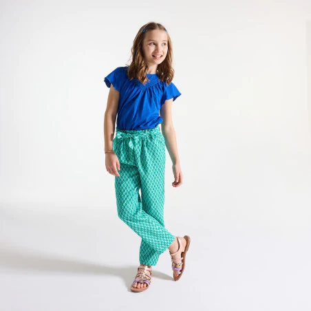Girls green printed wide leg trousers.