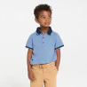 Boy's sky blue jersey piqué polo shirt with short sleeves