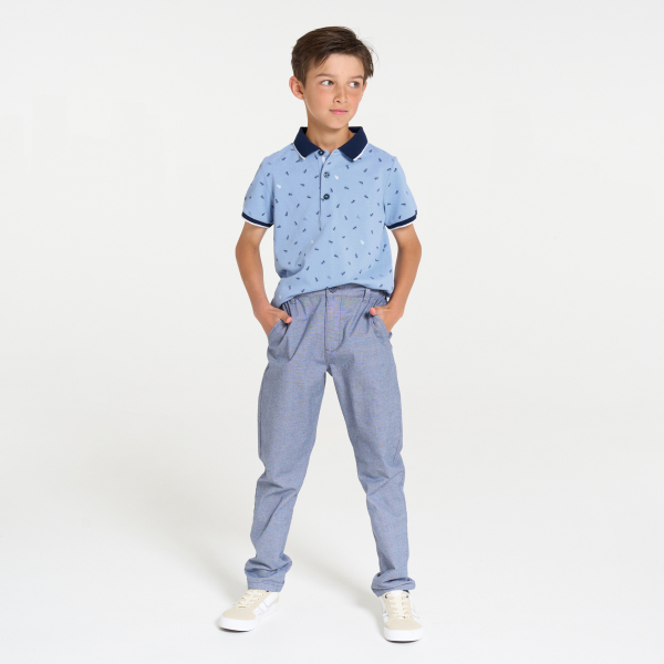 Boy's blue jersey piqué printed polo shirt with short sleeves
