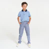 Boy's blue jersey piqué printed polo shirt with short sleeves