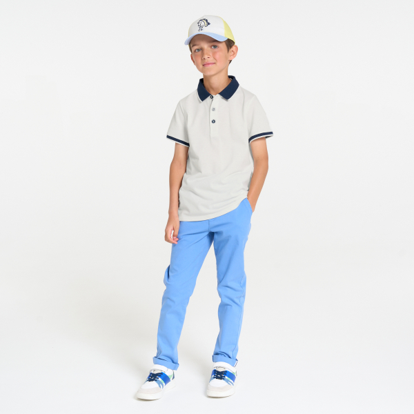 Boy's white jersey piqué polo shirt with short sleeves