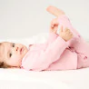 Newborn baby girl's pink floral knitted jumper and trousers