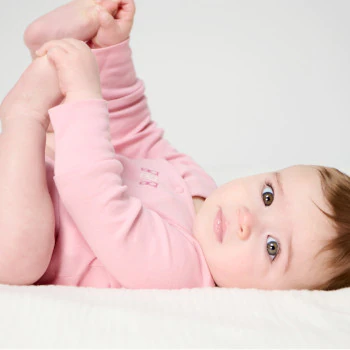 Newborn pink bodysuit with size extender (set of 2)