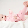 Newborn baby girl's pink floral knitted jumper and trousers