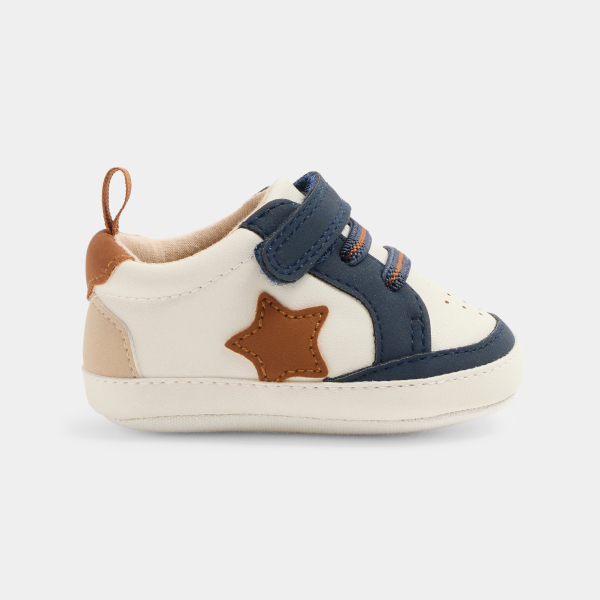 Newborn boy's blue low-top trainers
