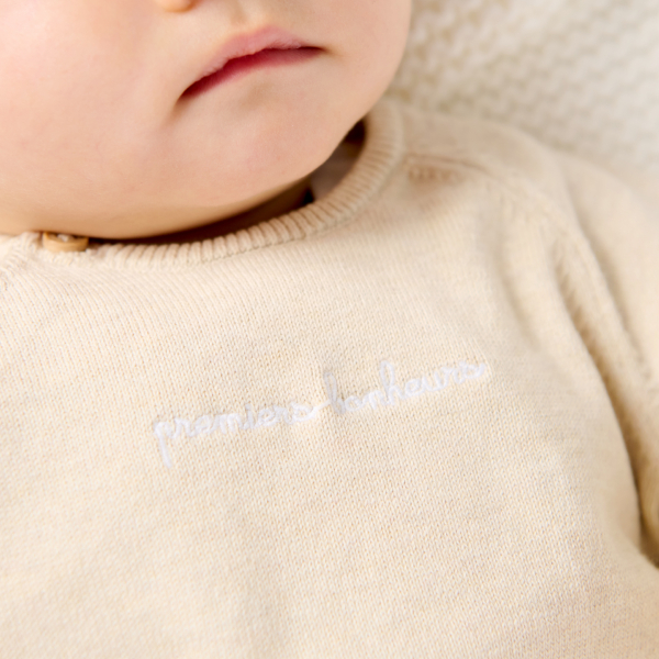 Baby girl's pink knitted jumper and trousers